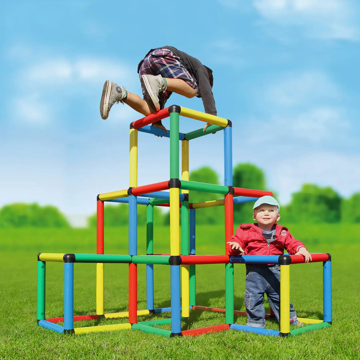 Children climbing a tall tiered QUADRO cube pyramid outdoors